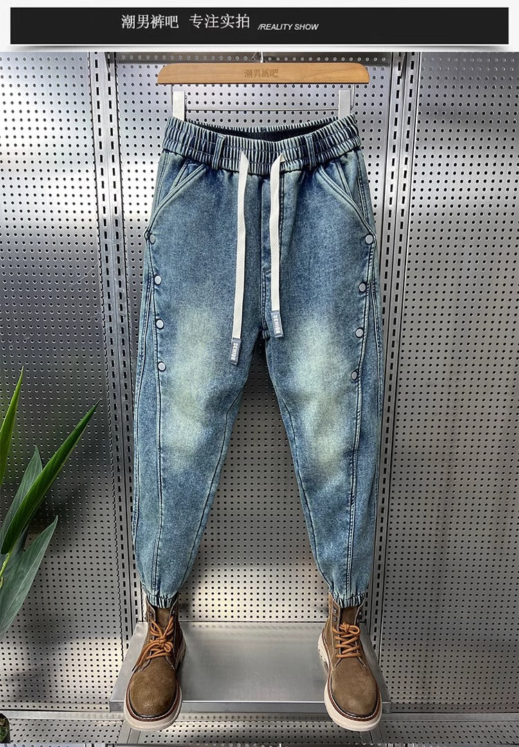 Mens Washed Denim Jeans With A Vintage Design, Featuring Button Detailing And A Tapered Leg