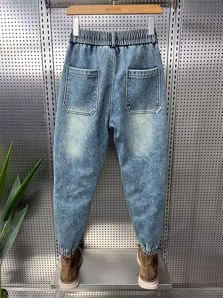 Mens Washed Denim Jeans With A Vintage Design, Featuring Button Detailing And A Tapered Leg