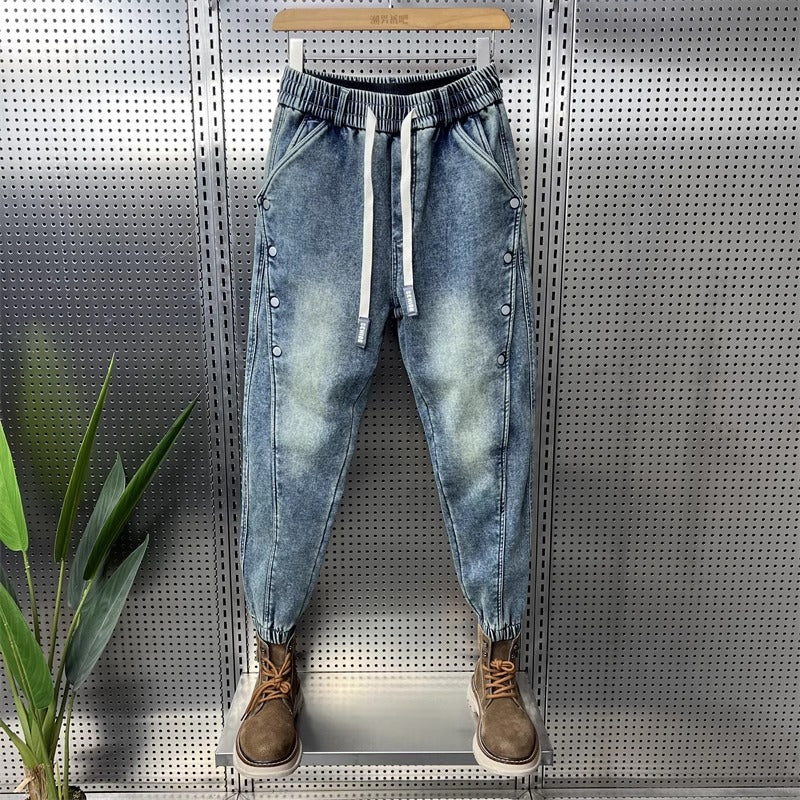Mens Washed Denim Jeans With A Vintage Design, Featuring Button Detailing And A Tapered Leg