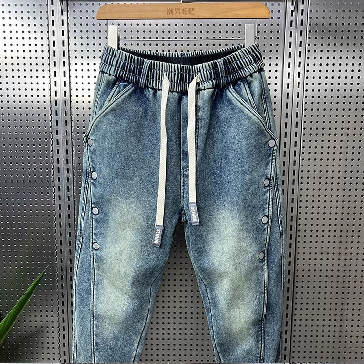 Mens Washed Denim Jeans With A Vintage Design, Featuring Button Detailing And A Tapered Leg