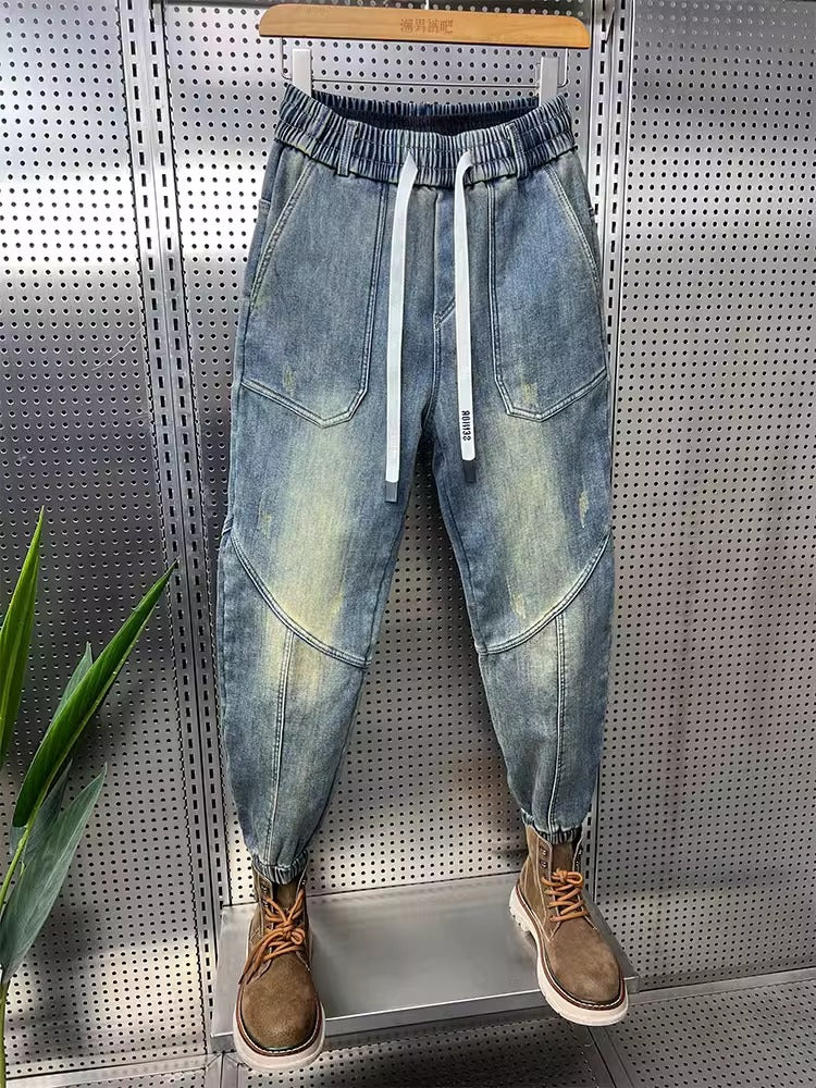 Mens Washed Denim Jeans With A Vintage Design, Featuring Button Detailing And A Tapered Leg
