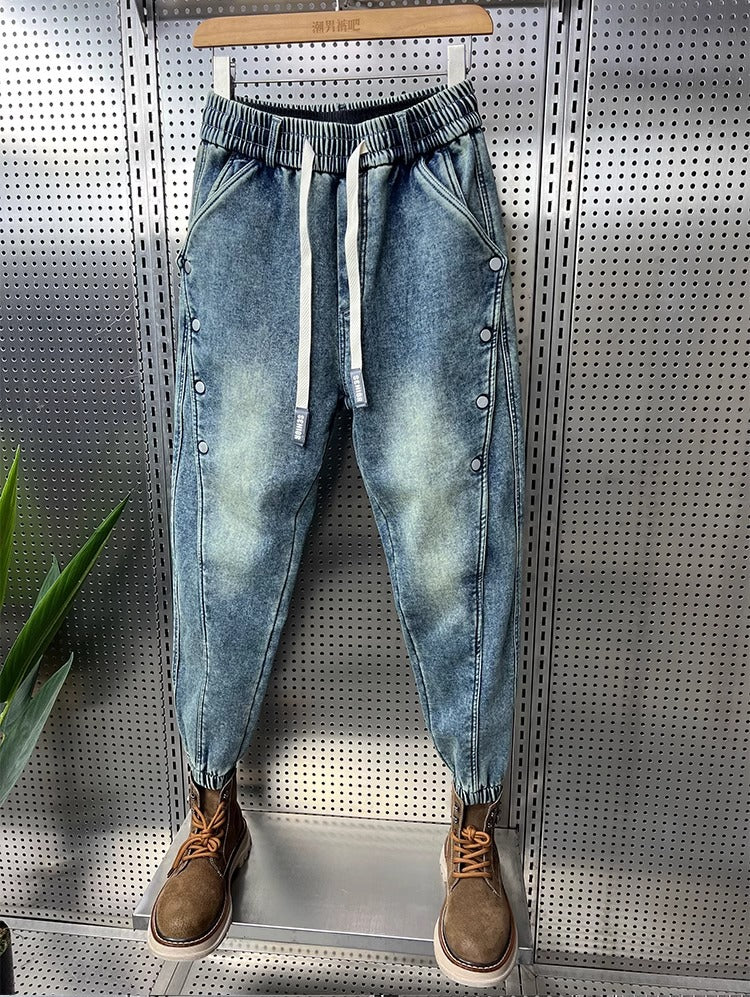 Mens Washed Denim Jeans With A Vintage Design, Featuring Button Detailing And A Tapered Leg