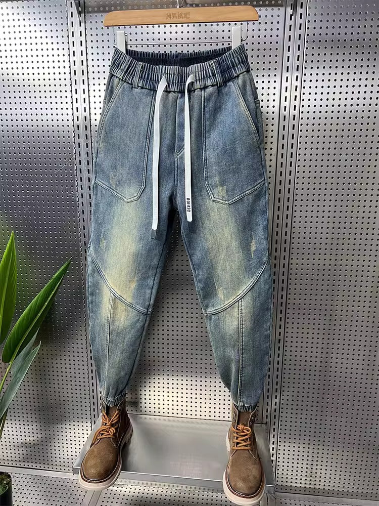 Mens Washed Denim Jeans With A Vintage Design, Featuring Button Detailing And A Tapered Leg