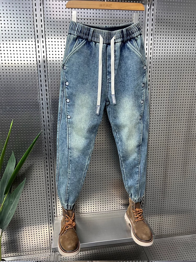 Mens Washed Denim Jeans With A Vintage Design, Featuring Button Detailing And A Tapered Leg